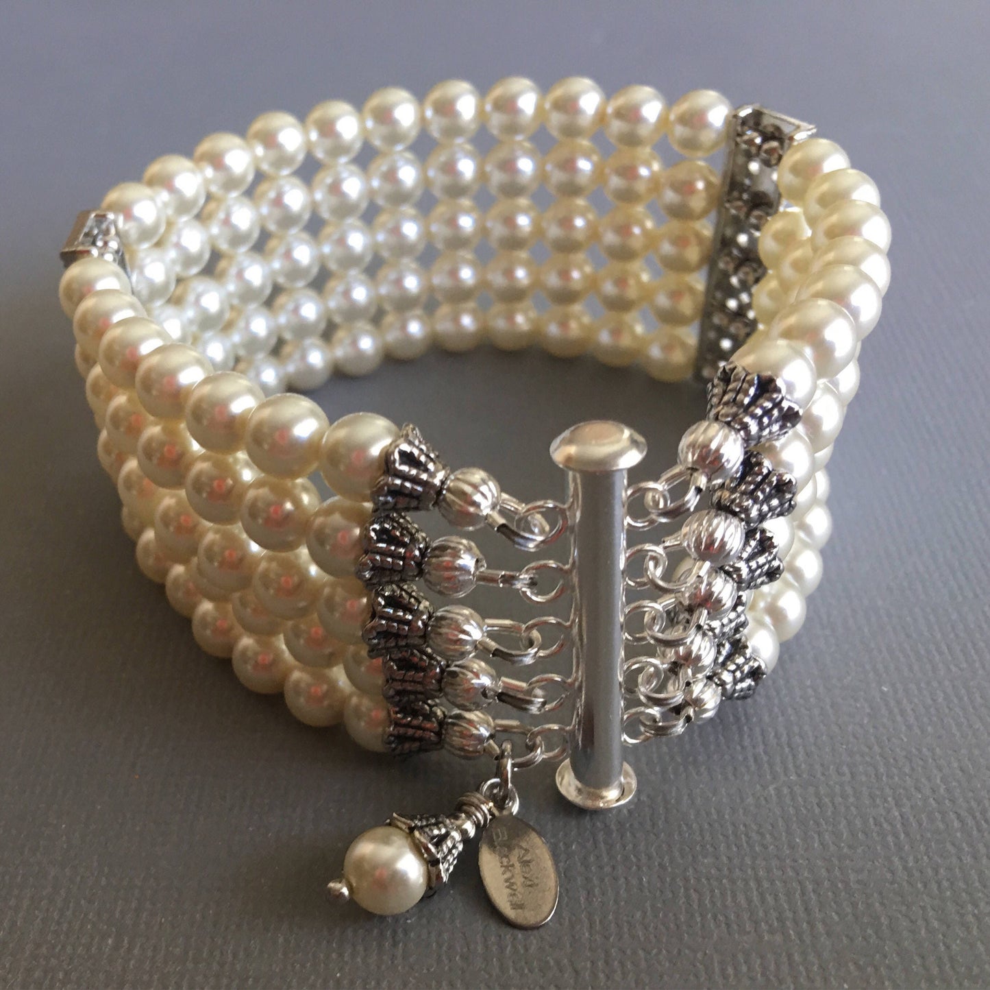 Pearl Bridal Bracelet with Silver bars and rhinestone is a 5 multi strands cuff of crystal glass Pearls in Cream ivory or choice of color