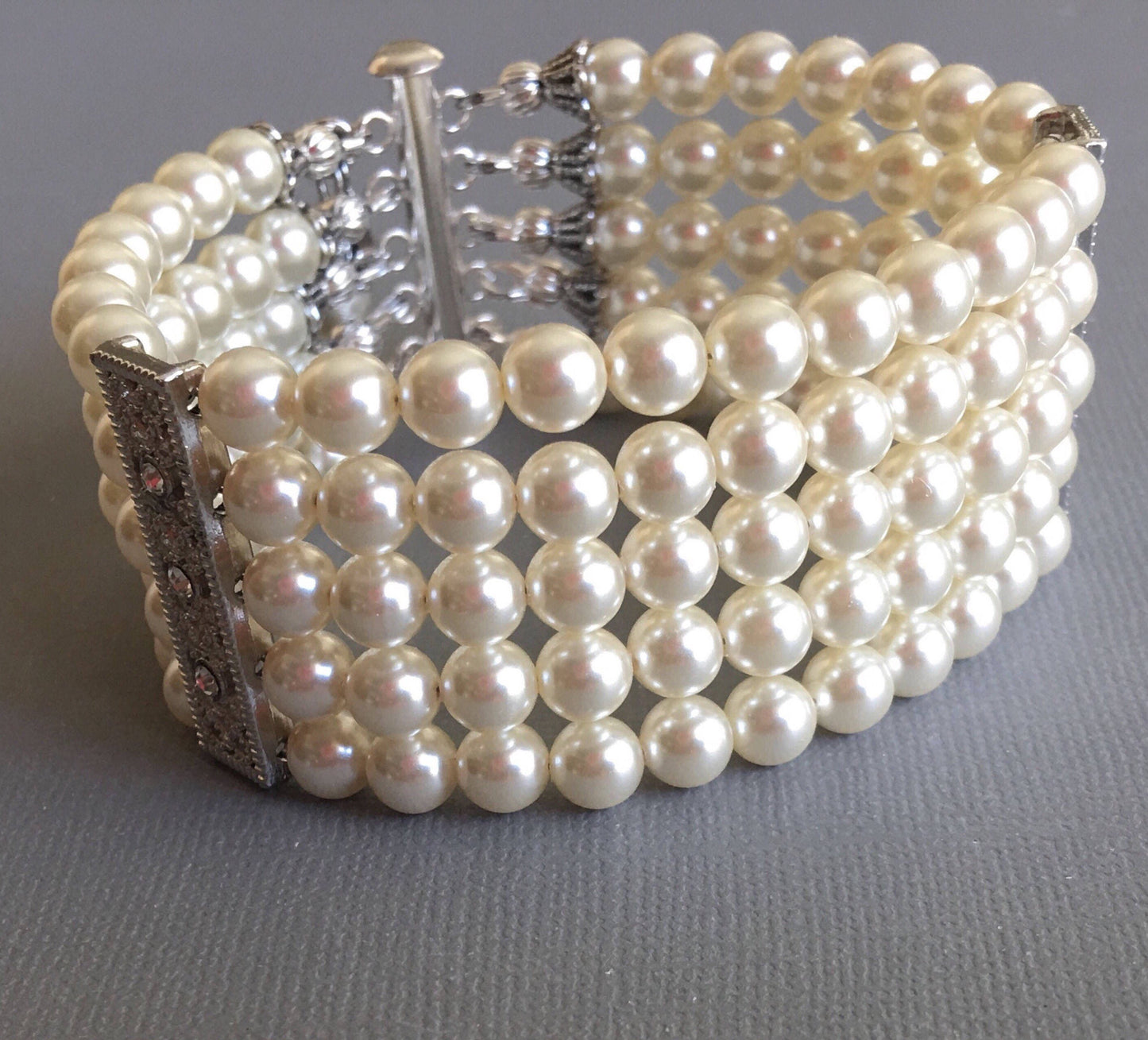 Pearl Bridal Bracelet with Silver bars and rhinestone is a 5 multi strands cuff of crystal glass Pearls in Cream ivory or choice of color